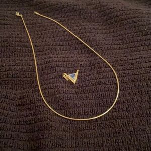 14k gold cylinder necklace with tanzanite pendant